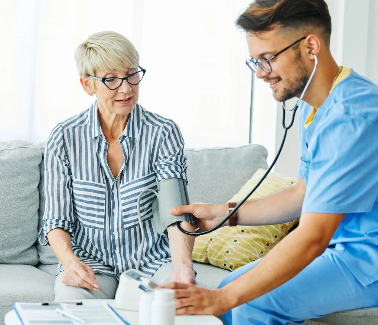 Nurse and doctor taking care of a senior patient